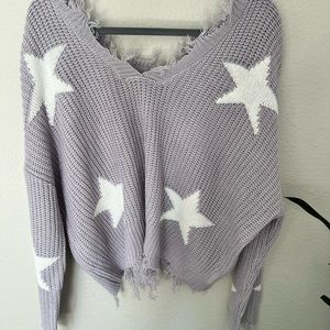 Off the shoulder tattered sweater